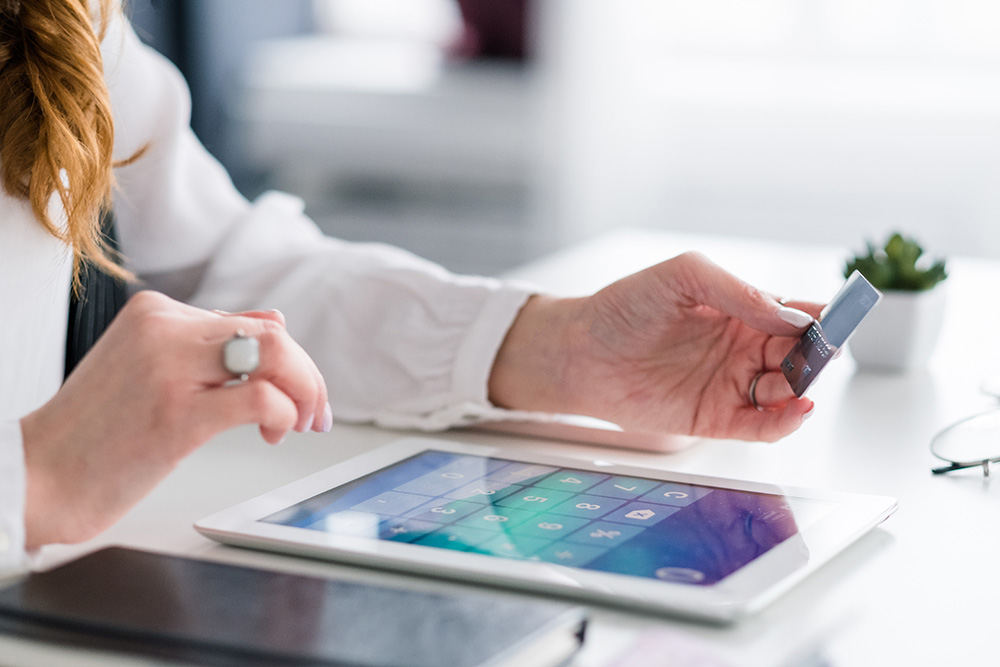 Collection lawyer holding credit card and tablet Collection lawyer holding credit card and tablet