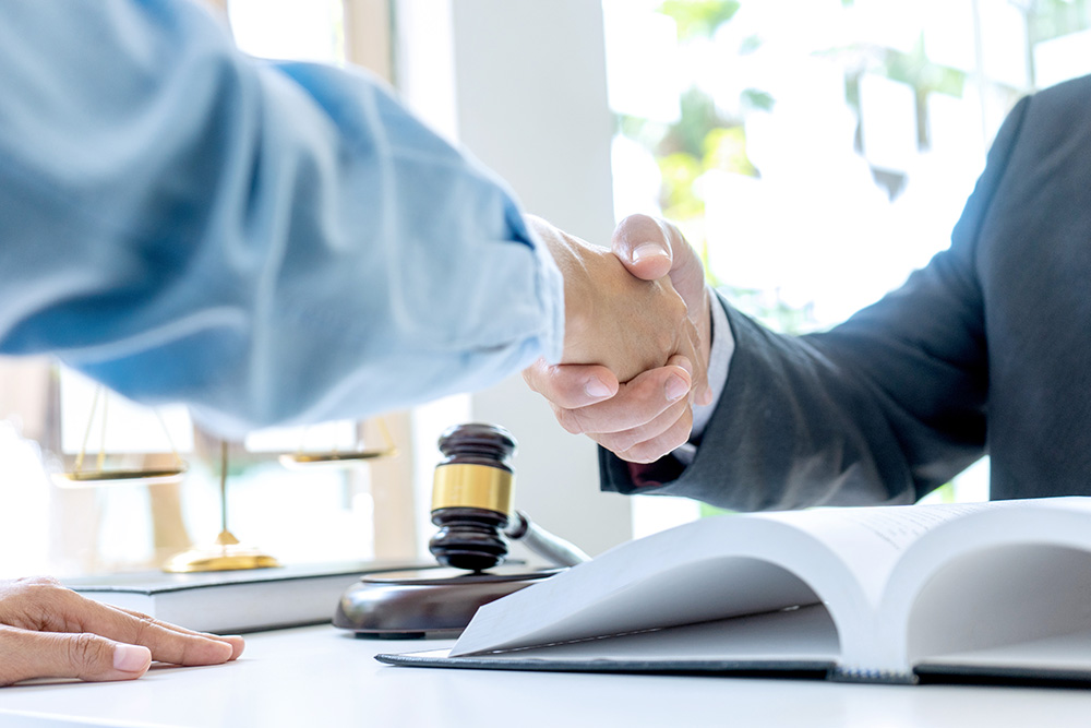 Collection lawyer handshaking a client