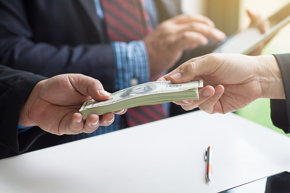 Client hand over cash to collection lawyer