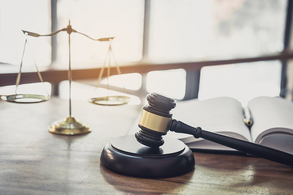 Scales and Gavel on Desk of Collection Attorney in San Diego