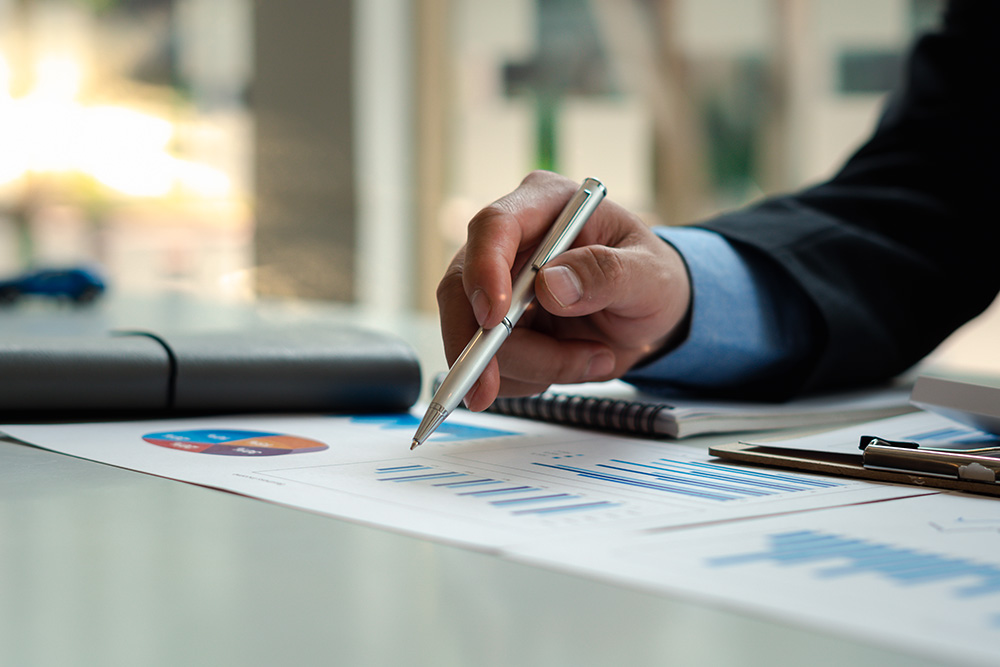 Employee analyzing data on paper