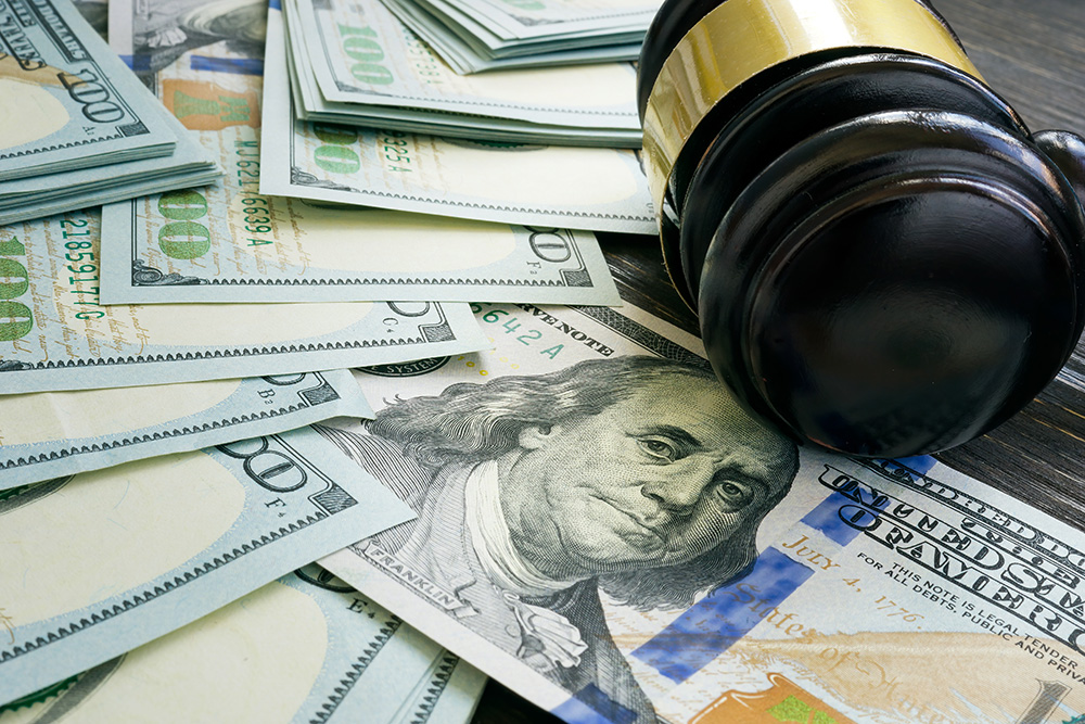 Gavel Sitting on Table with Money - Sacramento Collection Services Graphic