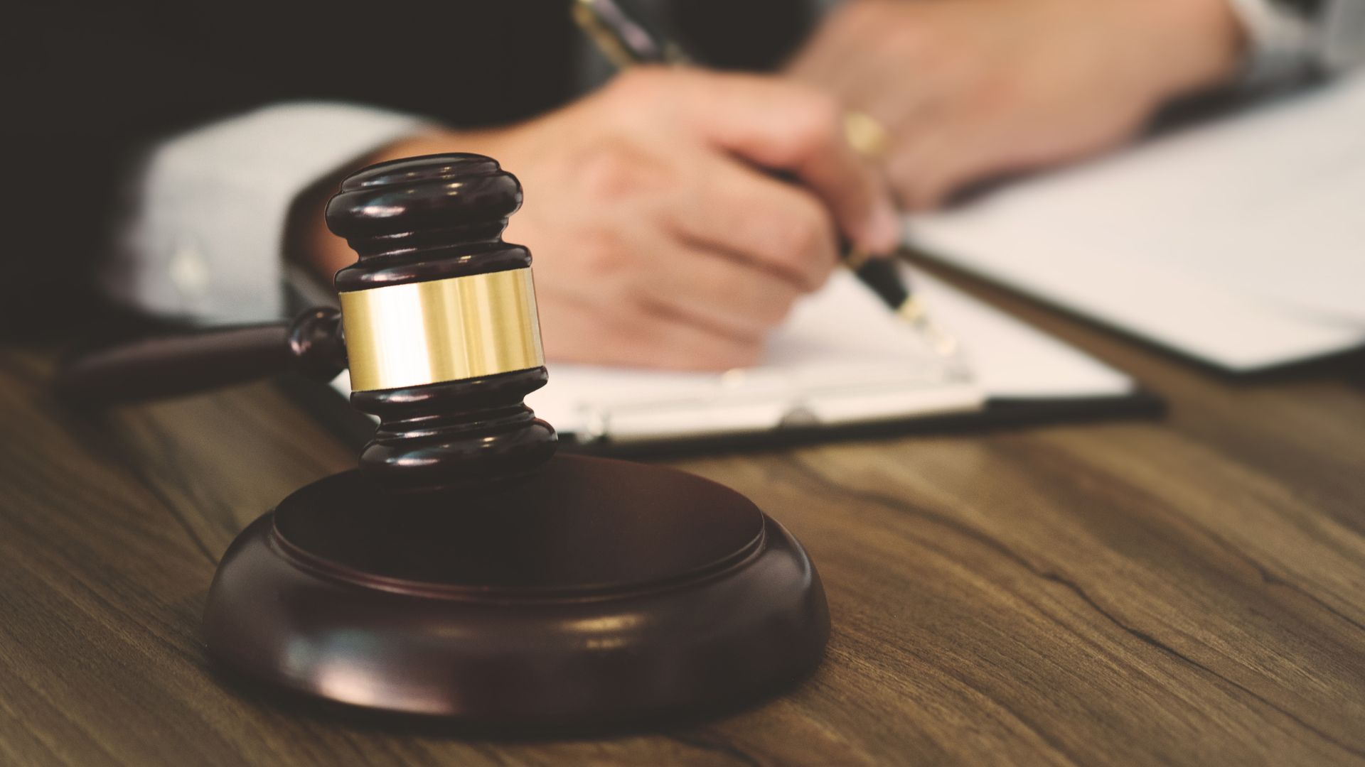Gavel sitting on collection attorney’s table Gavel sitting on collection attorney's table