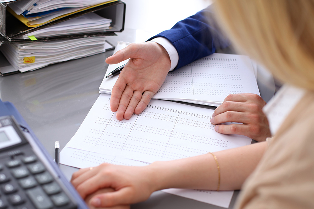 Debt collection lawyers looking at reports