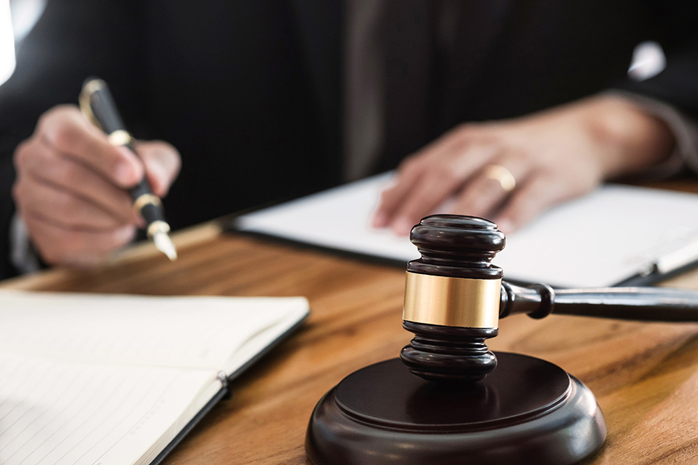 Gavel sitting on collection attorney's table